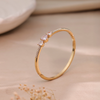 Triple Heart Elegance Gold-Plated Bangle