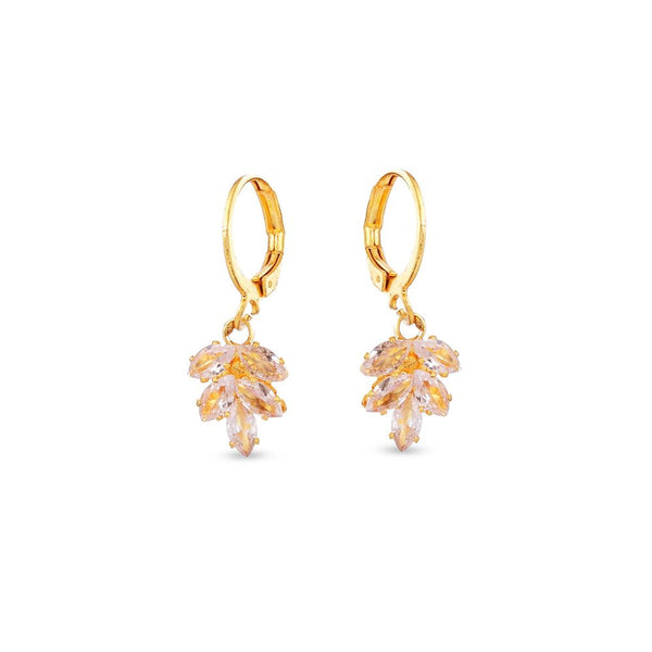 Gold earrings with leaf-like designs on a white background