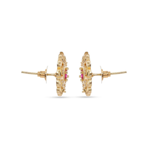 Gold hoop earrings with pink gemstones on a white background